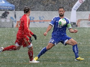 Oblivious to the snow falling in Fredericton on Sunday, UBC's fifth-year midfielder Greg Smith, finished his CIS career in glorious fashion, helping the 'Birds to a 1-0 win over Laval and its second straight national title. (Photo -- Fran Harris, UNB athletics)