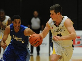 Former foes, UBC's Jordan Jensen-Whyte (left) and TWU's Tonner Jackson are new teammates this season, and among just eight healthy on the roster as the blue-and-gold welcome the Spartans to War on Friday and Saturday. (PNG file photo)