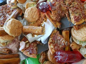 Governments must do more to crack down on junk food and their extra, unnecessary and unhealthy calories to fight the obesity crisis, says a doctor who treats overweight people. Here’s a sample of bad food collected in Melbourne, Australia, for a 2012 campaign against junk food led by British celebrity chef Jamie Oliver. (GETTY IMAGES FILES)