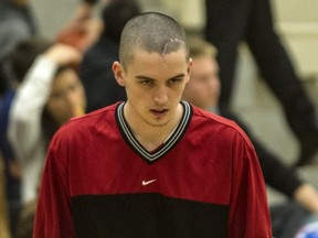 On Tuesday, as Nic Hughes prepared for Terry Fox's home opener against Vancouver College, there was no mistaking the scars of his summer. (Steve Bosch, PNG photo)