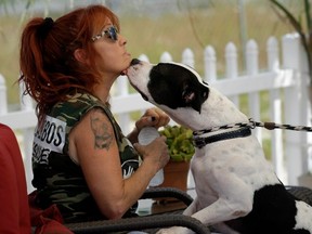 Many people would like to ban pit bulls but others, like Tia Maria Torres of the show Pit Bulls and Parolees, say they can be great dogs if well trained. (THE ASSOCIATED PRESS FILES)