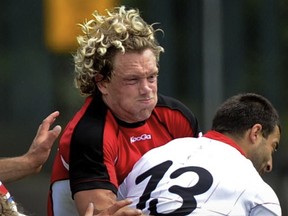 Team Canada's Phil McKenzie contains Georgia's Davit Kacharava during International Rugby exhibition match action at Swangard Stadium in Burnaby on Saturday, June, 23 2012. Les Bazso / PNG staff photo