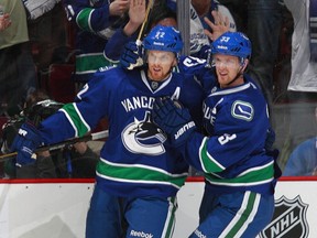 The Sedins: Getting chirped already.  (Photo by Jeff Vinnick/NHLI via Getty Images)