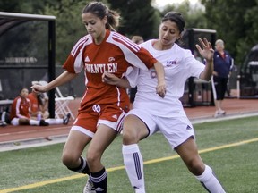 Kwantlen Polytechnic Eagles defender Monika Phunal holds off Simon Fraser Clan midfielder Karm Jawandha in women's exhibition soccer at Simon Fraser University in August. (Ron Hole, SFU athletics)