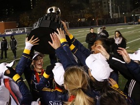 Langley's Trinity Western Spartans hoist the Gladys Bean Memorial Trophy, emblematic of CIS women's national soccer supremacy, following its 1-0 win over the Montreal Carabins in title tilt in Toronto. (Scott Stewart, TWU athletics)