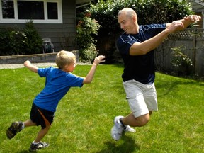 Tate Williams, then 7, playing tag with his dad, Rob Williams of Mixx Kids Fitness, in 2006, would earn a trip to the principal’s office today at Coghlin Fundamental School in Aldergrove for such allegedly dangerous ‘hands-on play.’ (Les Bazso/PNG FILES)