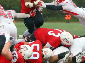 Simon Fraser running back Chris Tolbert goes up and over for a first-half touchdown Saturday against Dixie State at Terry Fox Field. (Ron Hole, SFU athletics)