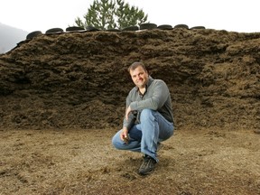 Chris Bush stands beside a pile of compost in this file photo.