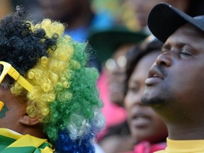 South African supporters react after South Africa defeated Argentina in the Rugby Championship first round match between Argentina and South Africa, on the Nelson Mandela Sport and Culture Day, at the Soccer City stadium in Soweto, on August 17, 2013. South Africa scored nine tries and fly-half Morne Steyn kicked 28 points as they crushed Argentina 73-13 Saturday in a Rugby Championship first round romp. AFP PHOTO / ALEXANDER JOE        (Photo credit should read ALEXANDER JOE/AFP/Getty Images)