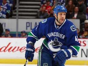 Andrew Alberts gets back into the lineup in the wake of Alex Edler's knee injury. (Photo by Jeff Vinnick/NHLI via Getty Images)