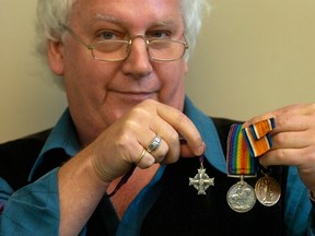 Province editor Andy Ross displays some of his grandfather's war medals in 2007 for a story he wrote about the grandfather he never knew. (Nick Procaylo/PNG FILES)