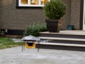 Still from Amazon.com promotional video shows a drone pretending to make a delivery to someone’s home — or possibly taking pictures of them for whatever spy agency is paying top dollar. (AMAZON.COM PHOTO)