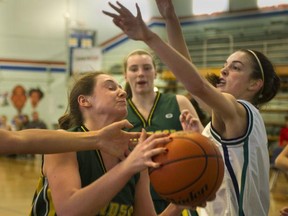 Windsor Dukes' Chantal Cumming battles Riverside Rapids' Megan Dally (right) during Telus Classic semifinals Friday at Churchill. (Steve Bosch  /  PNG staff photo)