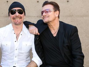 Musicians The Edge (L) and Bono are rumoured to be heading for B.C. to rehearse for U2's hotly anticipated upcoming world tour. — Getty Images Files