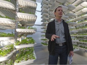 Donovan Woollard of Alterrus explains, in this file photo, how produce is grown in the rooftop greenhouse on top of a Vancouver city-owned parkade. Alterrus has since claimed bankruptcy.
