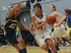 Brookswood Bobcats' point guard Aislinn Konig (right) drives past Grace Tadrous of MEI in the final of Saturday's Top 10 Shootout in Coquitlam. (Jason Payne, PNG)