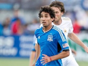 The Whitecaps added midfielder Mehdi Ballouchy to the roster on Monday.