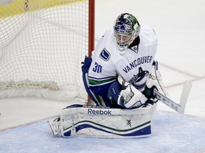 Vancouver Canucks goalie Joacim Eriksson, of Sweden, watches the puck go in the net on a goal by Anaheim Ducks' Nick Bonino during the second period of an NHL hockey game on Wednesday, Jan. 15, 2014, in Anaheim, Calif. (AP Photo/Jae C. Hong)