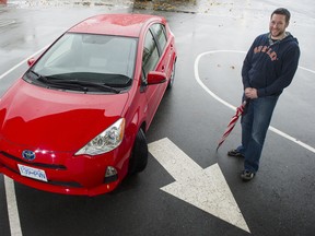David Ford with the 2013 Toyota Prius c being used by 10 readers as part of the Province Commuting Challenge.