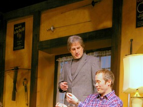 The games playwrights play: Sidney (Drew Taylor), Clifford (James Behenna) and Houdini's handcuffs in Metro Theatre's Deathtrap. Photo by Tracy Chernaske.