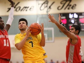 Denver Sparks-Guest of Coquitlam's Gleneagle Talons powers his way past Surrey's Holy Cross Crusaders. (PNG photo by Kim Stallknecht)