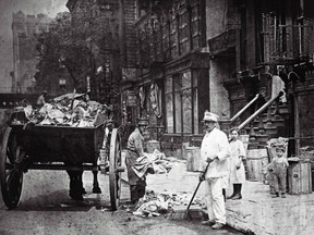 Garbage men clean up the filthy streets of New York City in the early 1900s with a horse and cart and brooms. It wasn’t uncommon then to leave the bodies of dead animals such as horses in the streets for weeks before they got hauled away.