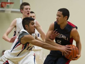 Yale's Jassi Gill (left) grabs for the prize Friday in Ladner against Sir Winston Churchill's Jason Claur during Kushnir Memorial semifinals at Ladner's Delta Secondary. (Gerry Kahrmann, PNG photo)