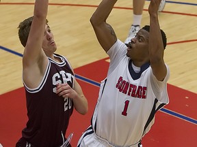 Simon Fraser University Guard Justin Cole gets a shot off in the paint against Seattle Pacific University forward Matt Borton in SFU's 73-49 loss to Seattle Pacific Saturday night atop Burnaby Mountain. (Ron Hole, SFU athletics)