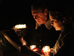 Simon Webb and Pippa Johnstone ponder Angelo's dark deeds by candlelight in The Honest Fishmongers' Measure for Measure. Photo by Ron Reed.