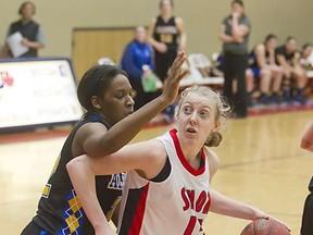 SFU's Meg Wilson (right) scored a career-high 23 points Thursday in her team's win over visiting Alaska Fairbanks at the West Gym. (Ron Hole, SFU athletics)