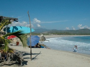 A vast stretch of beachfront in Oaxaca, Mexico, is just one of the many gorgeous spots in the world you may not see if you get a police record. (POSTMEDIA NEWS FILES)