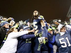 The Seattle Seahawks' Richard Sherman celebrates his team winning the NFC Championship on Jan. 19, 2014 over the San Francisco 49ers. Getty Images photo.