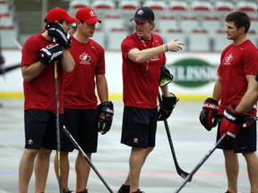 Patrick Sharp, Mike Babcock, Sidney Crosby and Chris Kunitz at Team Canada's summer orientation camp in August 2013.