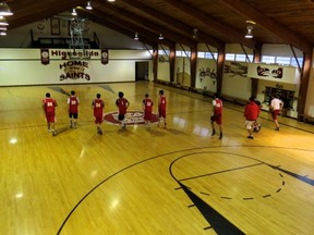 Members of the Queen Charlotte Saints senior boys basketball team are put through their paces on a hardwood floor crafted from Haida Gwaii old-growth forest. (Photo -- Jags Brown, Queen Charlotte athletics)