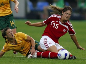 Kara Lang battles against Australia in the 2007 FIFA Women's World Cup. (LIU JIN/AFP/Getty Images)
