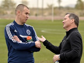 Whitecaps striker Kenny Miller talks with co-owner Jeff Mallett in Casa Grande, Ariz. (Marc Weber photo)