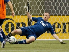 Peter Schaad, the voice of the Whitecaps, with one of his many saves on media day in 2013. Schaad will continue to call Whitecaps games for the TEAM 1410. The club and station announced a multi-year extension on Tuesday.