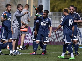 Whitecaps coach Carl Robinson chats with his team at half time of a pre-season game in Tucson, Ariz. (Marc Weber photo)