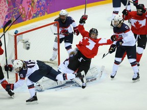 Marie-Philip Poulin scores the tying goal in the women's gold medal hockey game between Canada and the United States on Feb. 20, 2014. Getty Images photo.
