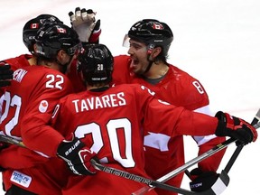 SOCHI, RUSSIA - FEBRUARY 13:  Jamie Benn #22 of Canada celebrates with his teammates after scoring a goal in the second period against Lars Haugen #30 of Norway during the Men's Ice Hockey Preliminary Round Group B game on day six of the Sochi 2014 Winter Olympics at Bolshoy Ice Dome on February 13, 2014 in Sochi, Russia.  (Photo by Streeter Lecka/Getty Images)