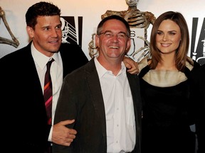 Writer-producer Hart Hanson (centre) with Bones stars David Boreanaz and Emily Deschanel. (Getty Images)