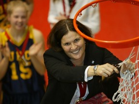 UBC Thunderbirds’ head coach Deb Huband cuts down the nets in Winnipeg in March of 2004 after her team defeated Regina to win the first of her three CIS national titles at the school. That team is holding a 10-year re-union this weekend as No. 9 UBC wraps up its regular season Saturday at home to Victoria. (Richard Lam, UBC athletics)