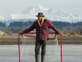Jas Singh stands on the flooded squash fields that are open for outdoor skating during the cold weather.