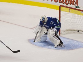 T.J. Oshie of the St. Louis Blues beats the Vancouver Canucks' Roberto Luongo in a shootout on Feb. 18, 2013. PNG file photo.