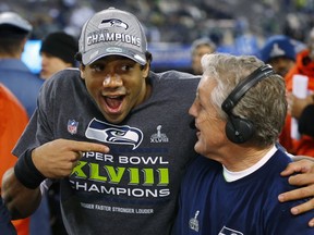 Seattle Seahawks' Russell Wilson and Pete Carroll. AP photo.