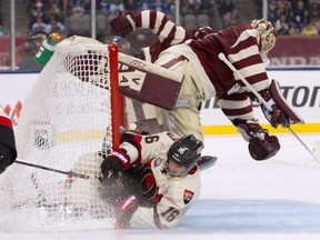 Clarke MacArthur of the Ottawa Senators upends goalie Eddie Lack #31 of the Vancouver Canucks while crashing the net during the third period in NHL action on March 02, 2014 during the 2014 Tim Hortons Heritage Classic at BC Place Stadium in Vancouver, British Columbia, Canada.  (Photo by Rich Lam/Getty Images)