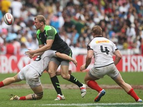 Craig Price of Wales is tackled during the Plate semi-final match between Wales and Canada during day three of the 2014 Hong Kong Sevens at Hong Kong International Stadium on March 30, 2014 in Hong Kong, Hong Kong.  (Photo by Mark Metcalfe/Getty Images)