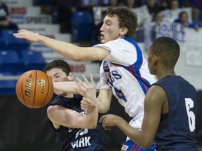 Lambrick Park's Calvin Somers (left) and Ishamail Abdulahi try to put the wraps on SMUS point guard Graeme Hyde-Lay during Saturday's BC Double A biys basketball championship final in Langley. (Gerry Kahrmann, PNG)