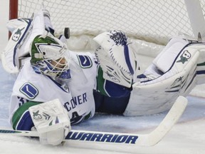 Vancouver Canucks goalie Eddie Lack lets in a goal against the Dallas Stars on March 6, 2014. AP photo.