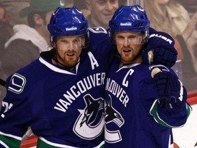 The Sedins had another huge possession game, keying the Canucks' 2-1 win over Calgary in Game 5 of their first-round series. (Photo: Getty)